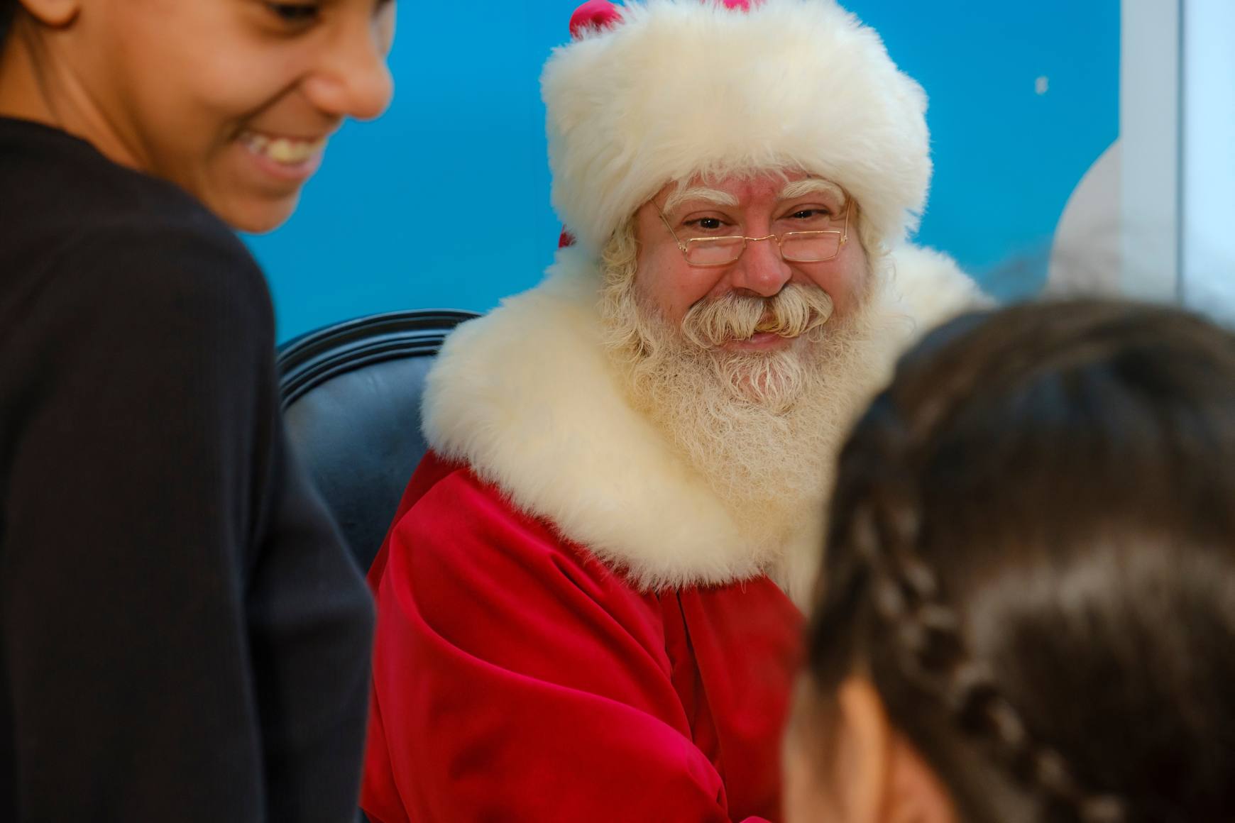 Image of Santa at MCNY with 2 Kids surrounding